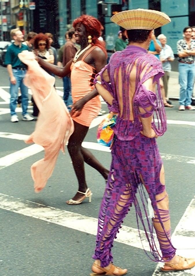 Download the full-sized image of A Photograph of Cocoa Rodriguez Wearing a Peach Fitted Dress