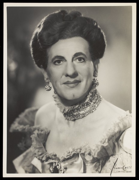 Download the full-sized image of An actor in drag, posing for a portrait. Photograph by Mme Yvonne, 194-.