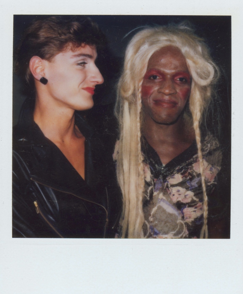 Download the full-sized image of A Photograph of Marsha P. Johnson With Blonde Hair and Red Eyeshadow, Next to Another Person