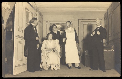 Download the full-sized image of Belgian prisoners of war, some in drag, performing a play at Friedberg camp, Germany . Photographic postcard, 191-.