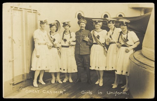 Download the full-sized image of Seven sailors standing together on deck. Photographic postcard, 1918.