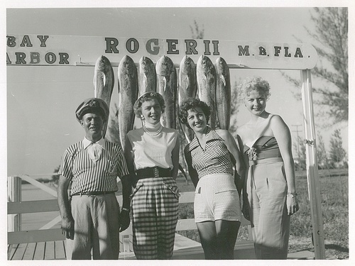 Download the full-sized image of Christine Jorgensen Poses on a Dock with "Frank" and Two Others