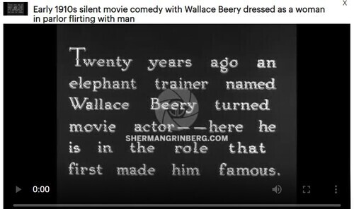 Download the full-sized image of Early 1910s silent movie comedy with Wallace Beery dressed as a woman in parlor flirting with man